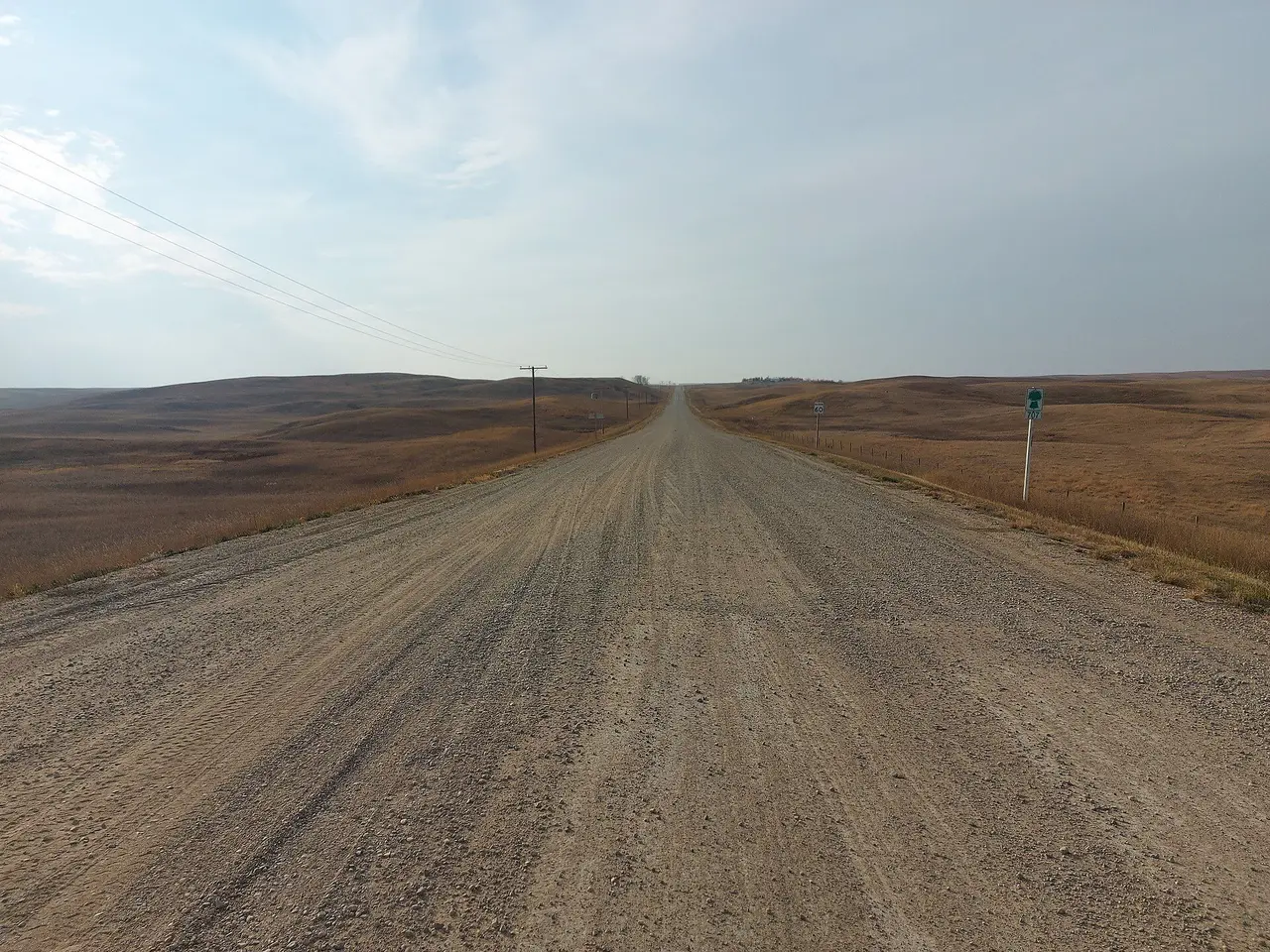 Gravel Highway 707 through the prairie hills, 2022